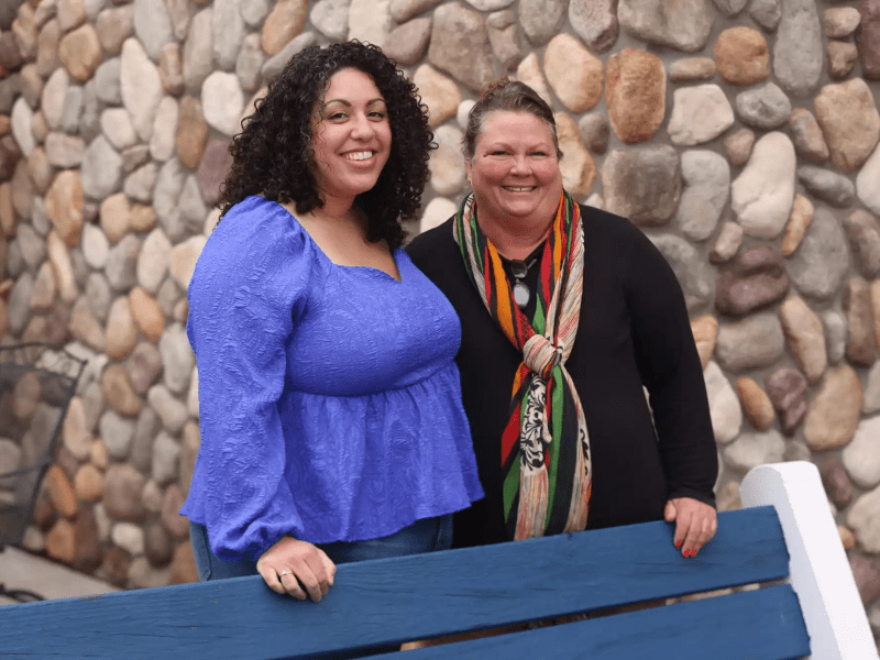 Ashley Kidd-Tatge (left) and Debby Prudhomme (right) stand for a portrait outside the Park Point Marina Inn on May 12 in Duluth.