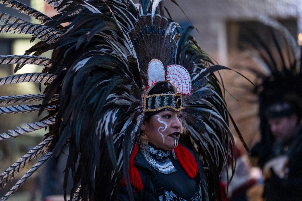 Aztec dance group performing during the protest